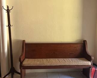 Wooden coat rack and church pew