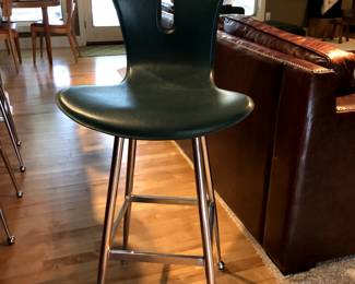 One of three leather bar stools  $450