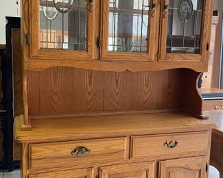 China cabinet with upper glass doors, 2 drawers and 3 lower wooden doors.