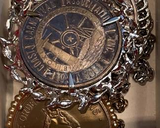 Several Biloxi framed Coin / Medallion necklaces.
