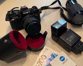 35mm camera with camera case, additional lens and flash