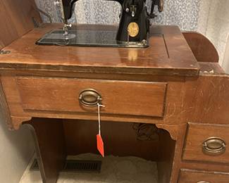 Vintage sewing machine and great oak case. Still works