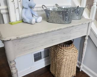 Taupe Entry Table, many woven baskets of different sizes & shapes