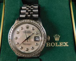 Mans Rolex diamond bezel watch