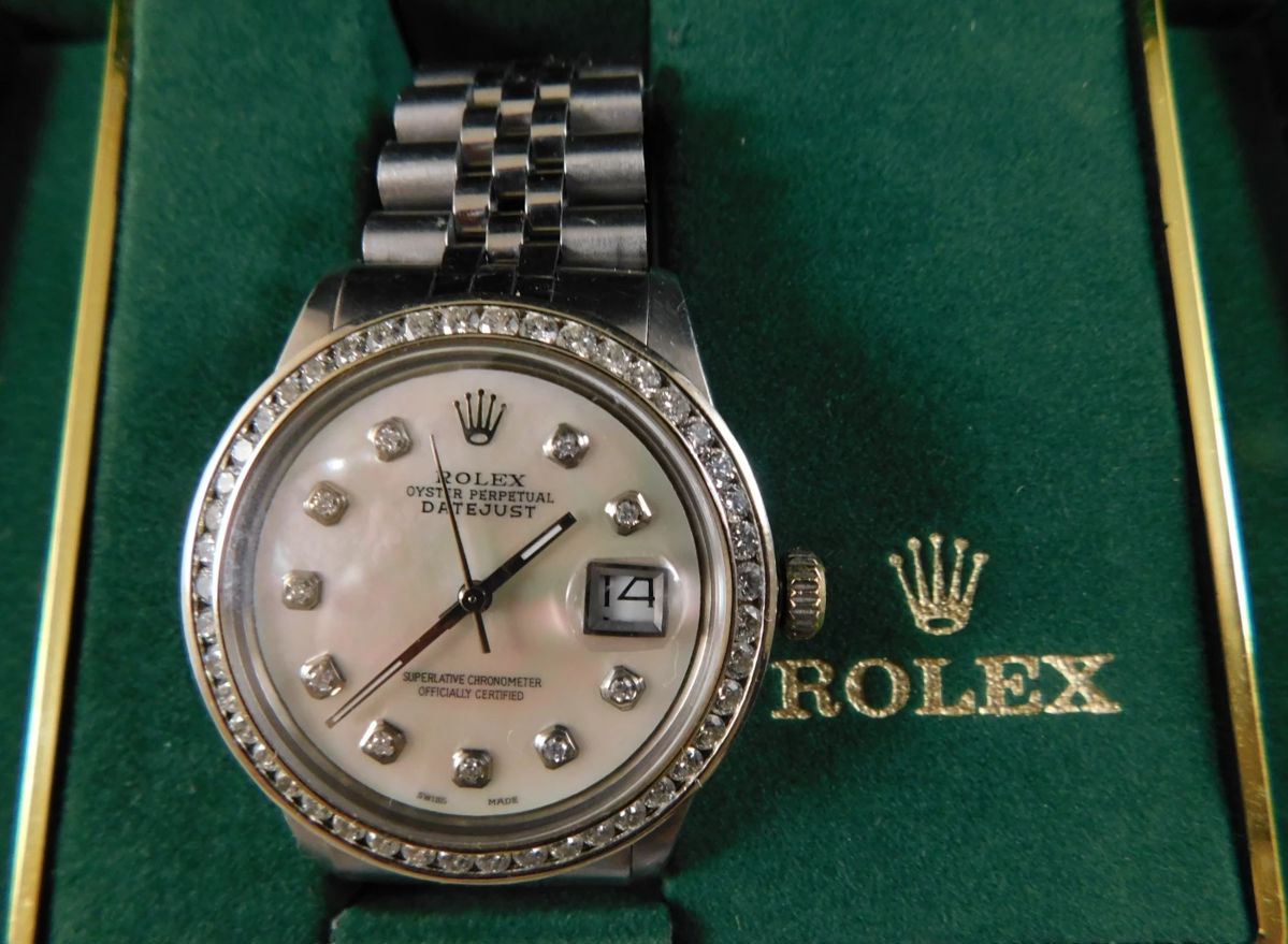 Mans Rolex diamond bezel watch