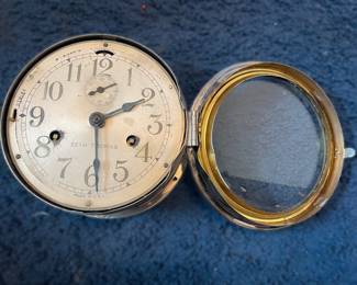 Clock is metal outside, bent hinge needs repair