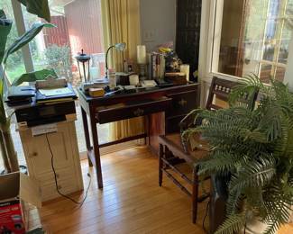 Small desk, Eastlake chair, small yellow chest, copy machine, artificial ferns and tree