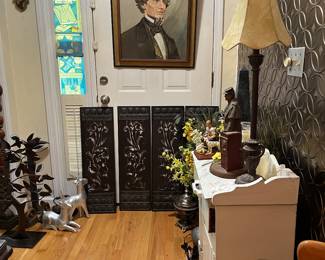 Oil on canvas Jefferson Davis with picture light, metal cutout panels, lamp, white wooden cabinet