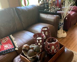 Another soft leather sofa with matching ottoman.