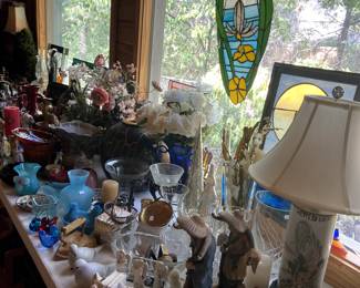 More decorator items, stained glass pieces, lamps, floral arrangements, etc.