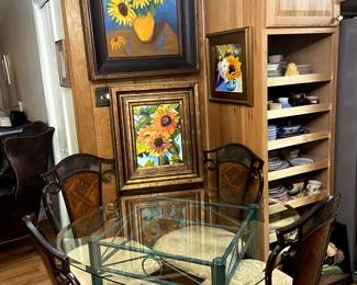 Glass top table, chairs, original art.