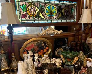 Asian inspired decor, animal figurines, large framed stained glass.