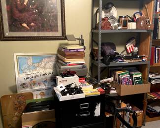 Office supplies, filing cabinets, storage aids, overhead projector, drum stand, paper and notebooks.