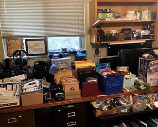 Vintage records, a few cameras, filing cabinets, TONS of notebooks, paper and supplies, boom box, karaoke machine, TVs, monitor.