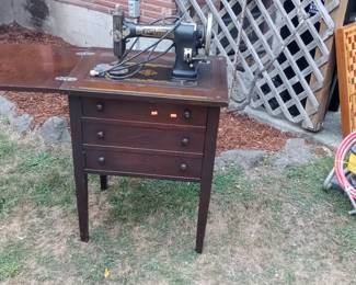 old White Rotary sewing machine and cabinet