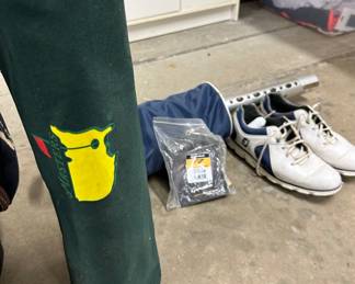 Men's golf clubs and shoes, Masters chair, and supplies