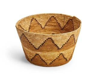 1016
Mid-20th century
A Native American Basket
The large polychrome coiled tapered basket with two rows of zigzag banding
7.25" H x 12.5" Dia.
Estimate: $100 - $200