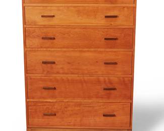 1019
Circa 1990s
A Stickley Metropolitan Tall Chest
With "piecrust" logo burn mark to interior of top drawer: Stickley
The cherry wood six-drawer dresser, the top revealing three divided compartments, each with wood pulls, set on four squared feet
56.25" H x 35.25" W x 19" D
Estimate: $400 - $600