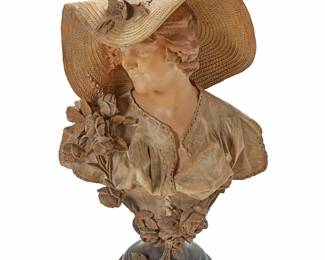 1021
20th century
An Art Nouveau-Style Terracotta Bust
Impressed to back: Reproduction Reservee / 1803 / 80 / 24 / [Goldscheider mark]; signed in the casting
After Goldscheider of Vienna, the earthenware bust depicting a woman in a wide hat with flowers
31.5" H x 18.5" W x 12" D
Estimate: $500 - $700