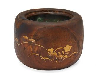 1028
Late 19th/early 20th century, Meiji Period 1868-1912
A Japanese Wood And Gilt Hibachi
Marked with a single Japanese character, branded into wood
With a rounded wood body inlaid with gilt, abalone, and stone, depicting a bird amongst foliate motifs; lined with a metal insert
7.5" H x 10.25" Dia.
Estimate: $300 - $500