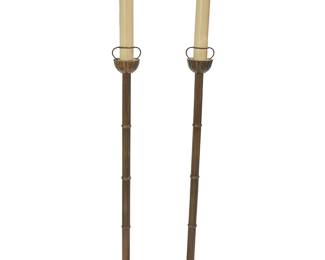 1030
Mid-20th century
A Pair Of Japanese Shokudai Candleholders
One with sticker to underside: Made in Japan
The polished brass floor-standing candleholders with channeled poles set on a round ribbed base
Each: 44.75" H x 9.5" Dia.
Estimate: $400 - $600