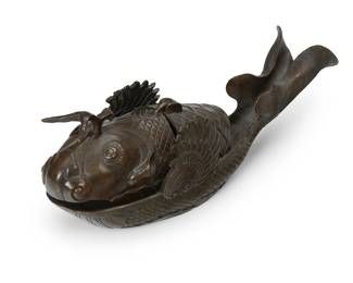 1033
Meiji Period 1868-1912 or later
A Japanese Bronze Koi Fish Koro
Embossed to the interior with six Kanji characters
The bronzer censer in the form of a stylized carp with hinged lid and fluted tail
4.5" H x 4" W x 10.75" D
Estimate: $500 - $700