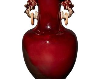1039
Late 20th century
A Chinese Flambé Glazed Porcelain Vase
Marked to the base with characters reading: Zhonghua Junyao (Chinese Jun ware)
With applied dragon handles, each supporting an unglazed ring, and an all-over deep scarlet glaze
12.5" H x 6" Dia.
Estimate: $300 - $500