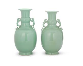 1044
20th century
A Pair Of Chinese Celadon Porcelain Vases
Marked to the underside in blue underglaze bearing an apocryphal reign mark for Qianlong Period (1711-1799)
Each with opposed dragon handles applied to the neck and an all-over uniform pale green-hued glaze
Each: 16.25" H x 10" Dia.
Estimate: $400 - $600