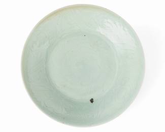 1047
Late Qing Dynasty 1644-1911
A Chinese Ceramic Celadon Platter
Paper label with Chinese characters to the underside
The large charger with floral motif to the rim
2.5" H x 14.75" Dia.
Estimate: $200 - $300