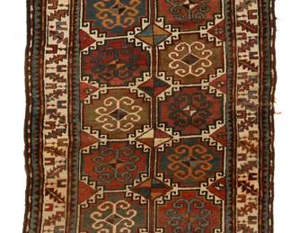 1052
Early/mid-20th century
A Kazak Area Rug
The wool-on-wool rug with repeating polychrome geometric motifs on a brick red ground
8' H x 4' W
Estimate: $600 - $800