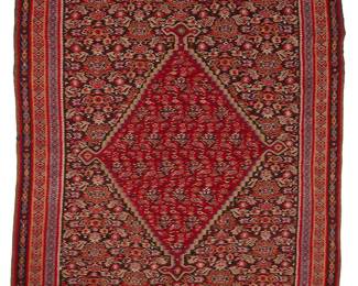1055
Early/mid-20th century
A Senna Flatweave Rug
The wool-on-cotton cotton flatweave rug with geometric motifs centering a cartouche on a crimson ground
6' 4" x 3' 10"
Estimate: $400 - $600