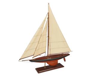1059
Mid-20th century
A Sloop Sailboat Model
Appears unmarked
The scale wood model featuring a black partially painted hull, brass riggings, and three cotton canvas sails with embroidered stripes, mounted on a wood base with a brass stand
34.25" H x 29" W x 4.75" D
Estimate: $400 - $600