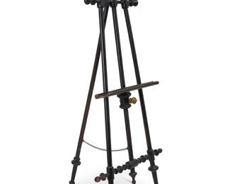 1067
Early 20th century
A Victorian Tripod Painting Easel
Appears unmarked
The painted black turned wood easel with three legs, the rear joined by a brass chain, featuring brass mounted accents and locking knob to the canvas platform, which is adjustable to five different heights
74.5" H x 33.5" W x 7.5" D
Estimate: $300 - $500