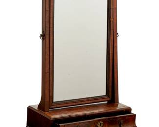 1071
Late 19th/early 20th century
A Tabletop Walnut Vanity
Appears unmarked
With an oscillating beveled mirror surmounting a single locking drawer with stylized bee and flower cast brass pulls
26" H x 15.5" W x 7.25" D
Estimate: $200 - $300