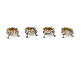 1080
Late 19th/early 20th century
A Set Of English Sterling Silver Salt Cellars
Marked to undersides with hallmarks for sterling, London, and maker: DMTS
Each with vermeil interior and repoussé floral motifs, raised on three lion mask legs with ball and claw feet, 4 pieces

Each: 2" H x 3.325" Dia.
18.785 oz. troy approximately
Estimate: $400 - $600
