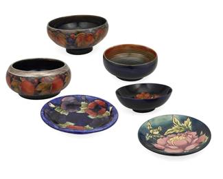 1082
Late 20th/early 21st century; Burslem, England
A Group Of Moorcroft Pottery
Each with Moorcroft backstamp; with further various dates and markings
Each glazed ceramic with various floral and fruit motifs, comprising a bowl with silver-plated rim, three bowls, and two plates, 6 pieces
Largest: 4.25" H x 10" Dia.
Estimate: $300 - $500