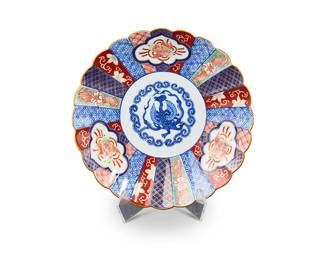 1084
Late Meiji Period 1868-1912 or later
A Set Of Ten Japanese Kutani-Style Imari Porcelain Plates
Each with a two-character mark to the underside in red enamel
Each porcelain plate with a lobed rim decorated with bright polychrome enameled phoenix and geometric motifs with gilt accents to the recto and blue stylized foliate motifs to the verso, 10 pieces
Each: 1.25" H x 8.25" Dia.
Estimate: $200 - $300