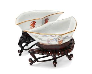 1090
Guangxu Period 1874-1908 or later
A Pair Of Chinese Hexagonal Porcelain Dishes
Marked to the underside in red enamel bearing a reign mark for Guangxu Period (1874-1908)
Two unusually shaped ceramic dishes, each with a painted scene, one likely depicting of one of the Taoist Eight Immortals, Liu Hai, riding the three-legged "wealth frog" and the other depicting the Immortal, Zhang Guo and his magical white donkey, each vessel with two bats depicted on the reverse side in red underglaze; each with a foliate carved wood stand, 4 pieces
Each with stand: 5.5" H x 8" W x 5" D
Estimate: $200 - $400