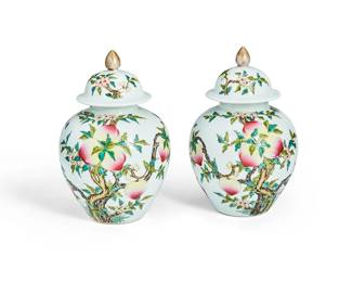 1091
20th century
A Pair Of Chinese Porcelain Ginger Jars
Each marked to the underside in blue enamel bearing an apocryphal reign mark for Qianlong Period (1711-1799)
The ceramic lidded jars featuring polychrome fruiting peach trees and bats, each lid surmounted by a gold-toned finial, 2 pieces
Each: 8.75" H x 5.75" Dia.
Estimate: $300 - $500