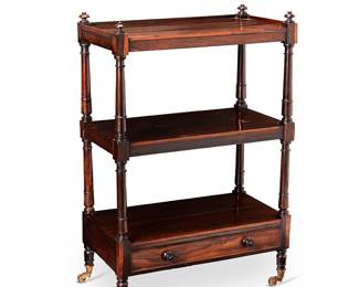 1108
Late 19th/early 20th century
A Continental Baroque-Style Walnut Pastry Table
Appears unmarked
With three shelves bolstered by four turned wood supports, surmounting a single drawer, and set upon four brass, tapered cup casters
40.5" H x 26.75" W x 14.5" D
Estimate: $300 - $500