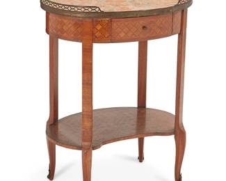 1109
Late 19th/early 20th century
A Louis XV-Style Tea Table
With oval, inset marble top surrounded by a brass gallery rail over a single drawer and kidney-shaped undertray with parquetry inlay
29.25" H x 22.25" W x 17" D
Estimate: $300 - $500