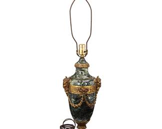 1116
Early/mid-20th century
An Empire-Style Green Marble And Gilt Bronze Table Lamp
Appears unmarked
The urn-form single light lamp with gilt bronze mounted and banding to the carved green marble body, electrified
35" H x 7.5" Dia.
Estimate: $200 - $400
