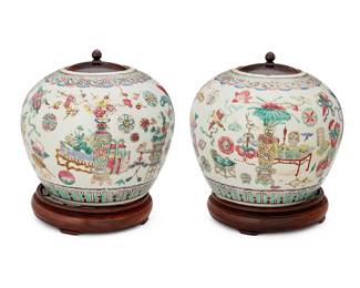 1125
Late Qing Dynasty 1636-1912 or later
A Pair Of Chinese Famille Rose Porcelain Ginger Jars
Each appears unmarked
Each ceramic vessel with enameled decoration depicting a continuous tableau of floral arrangements in the Famille Rose palette; each with a wood lid and set upon a carved wood base, 4 pieces
Each with stand: 10.5" H x 7.5" Dia.
Estimate: $300 - $500