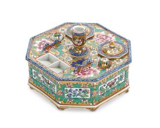 1126
Early 20th century
A Chinese Famille Rose Porcelain Inkwell
Marked to the underside with Chinese characters in red underglaze
Comprising of an octagonal inkwell with foliate and butterfly polychrome motif on a gilt background with two porcelain-handled metal seals, two removable ink pots, a candle holder, and a brush rest, 5 pieces
4" H x 7.25" W x 7.25" D
Estimate: $400 - $600