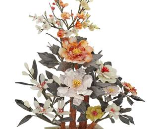 1130
20th century
A Chinese Carved Stone Tree
Appears unmarked
The tree decorated with carved rose quartz peonies and various other hardstone flowers with possibly nephrite leaves, affixed to woven fabric-encased and pliable "branches," stemming from a painted plaster trunk, set in a weighted stone pot
23.25" H x 15" W x 9.5" D
Estimate: $100 - $200