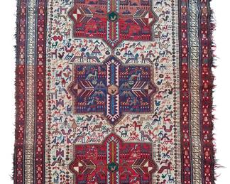 1135
20th century
A Small Caucasian Area Rug
The flat weave wool-on-cotton rug with polychrome pictorial aulian motifs surrounding three central medallions on an ivory ground
6' 11" H x 4' 7" W
Estimate: $400 - $600