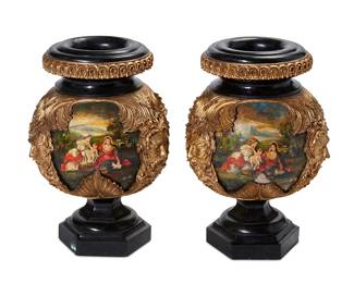 1140
19th/20th century
A Pair Of Baroque-Style Marble Urns
The black marble urns, each with three gilt composition masks of a bearded man and scrolled acanthus leaf motifs over three painted figural landscape scenes, 2 pieces
Each: 23" H x 16" Dia.
Estimate: $500 - $800