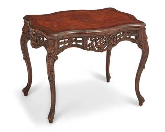 1145
Late 19th century
An Italian Carved Wood Occasional Table
With a burl veneer top over an openwork carved apron and raised on four legs
21" H x 27.25" W x 18.75" D
Estimate: $300 - $400