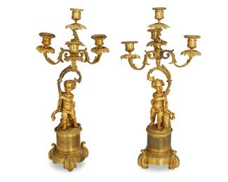 1148
Late 19th/early 20th century
A Pair Of Gilt-Bronze Figural Candlesticks
Opposing pair of standing putti holding a four-light candelabra on a pedestal base, 2 pieces
Each: 19.5" H x 9.25" L x 7.25" D
Estimate: $600 - $800