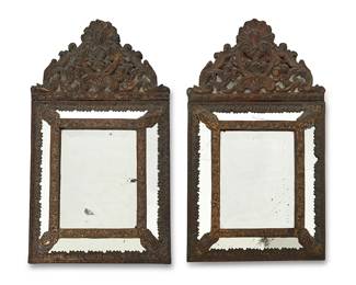 1155
A Pair Of Flemish-Style Cushion Wall Mirrors
Each appears unmarked
Two multi-paneled beveled mirrors with foliate stamped repoussé brass overlay, each mounted on a wood support for hanging, 2 pieces
Each: 23" H x 12.5" W x 2" D
Estimate: $200 - $300